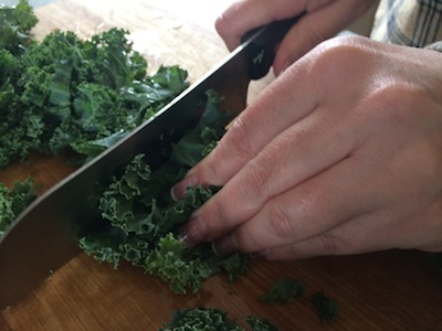 Chopping kale to bite sized pieces